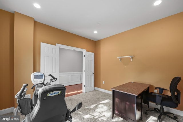 carpeted office with recessed lighting and baseboards