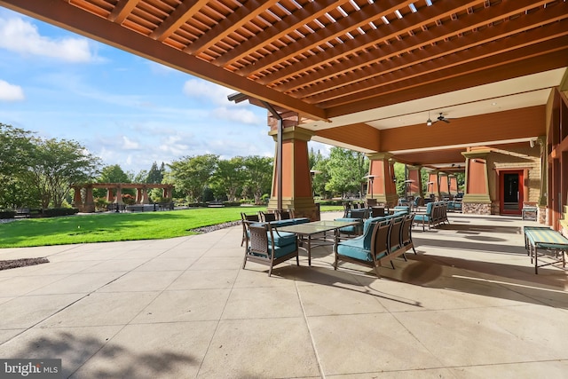 view of patio with a pergola, ceiling fan, and outdoor dining space