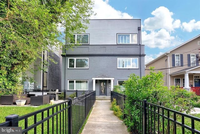 view of front of house featuring fence