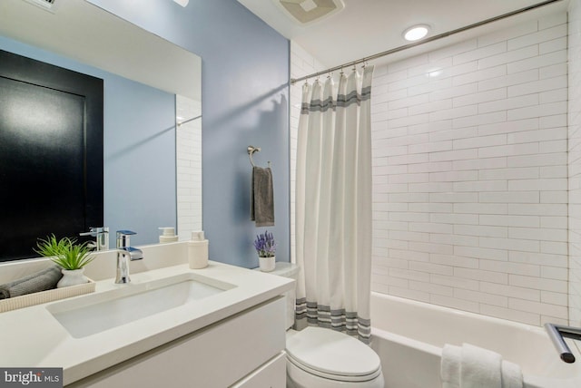 full bathroom featuring toilet, shower / tub combo, and vanity