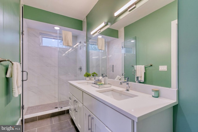 bathroom with a stall shower, tile patterned floors, double vanity, and recessed lighting