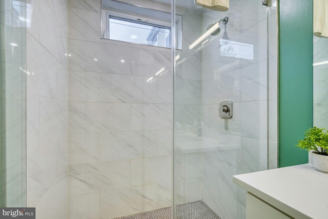 full bath featuring a stall shower and vanity