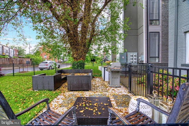 view of patio with outdoor lounge area and area for grilling