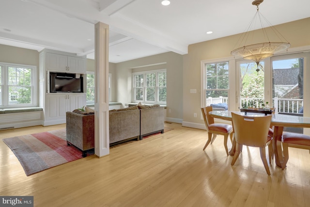 living area with a notable chandelier, beam ceiling, light wood finished floors, recessed lighting, and baseboards