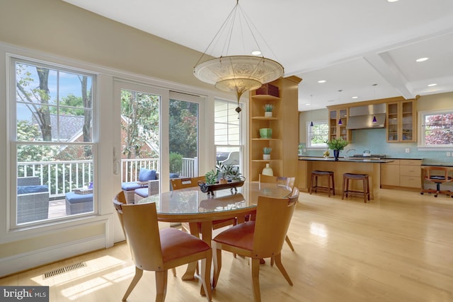 dining space with recessed lighting, a notable chandelier, visible vents, and light wood-type flooring