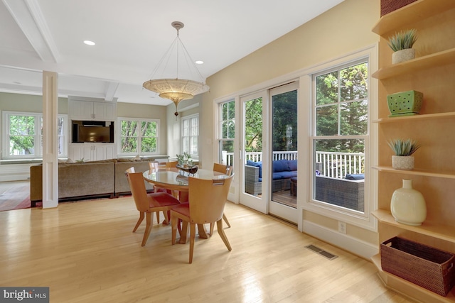 dining space with visible vents, recessed lighting, light wood finished floors, and beam ceiling
