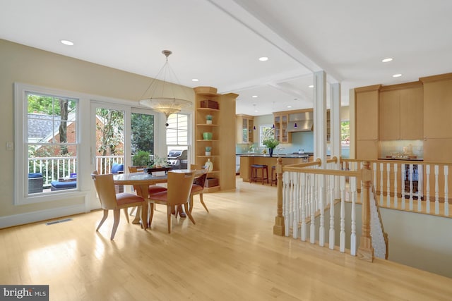 dining area featuring light wood-style floors, recessed lighting, and a healthy amount of sunlight