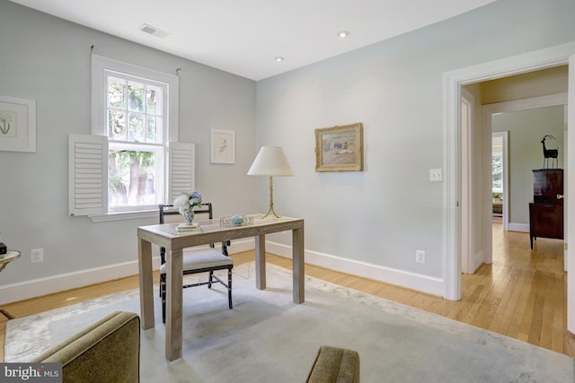 home office with light wood-style floors, recessed lighting, baseboards, and visible vents