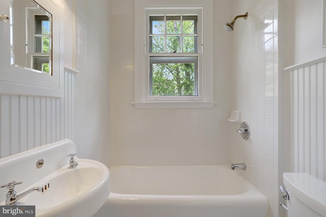 full bathroom with a sink, shower / bathing tub combination, and toilet
