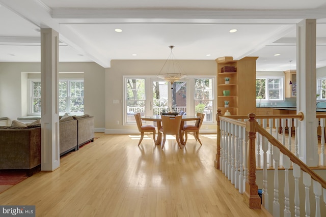 dining space featuring baseboards, recessed lighting, light wood finished floors, and beam ceiling