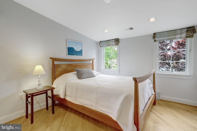 bedroom featuring recessed lighting, baseboards, visible vents, and light wood-type flooring