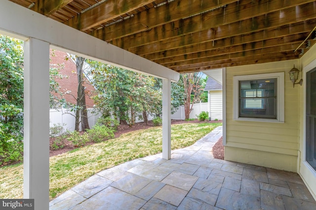 view of patio / terrace featuring fence