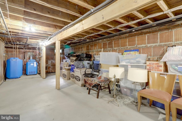 unfinished basement featuring a heating unit