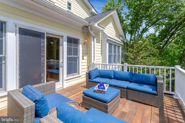 wooden terrace featuring outdoor lounge area