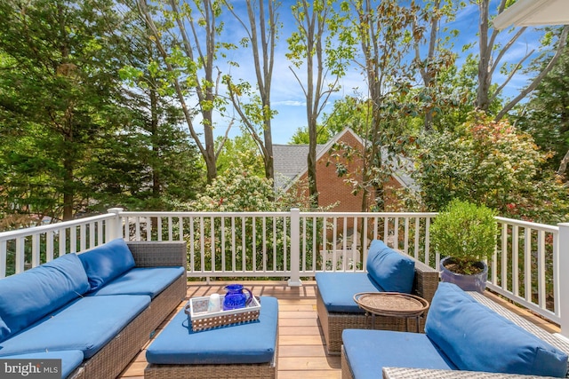 wooden terrace featuring outdoor lounge area