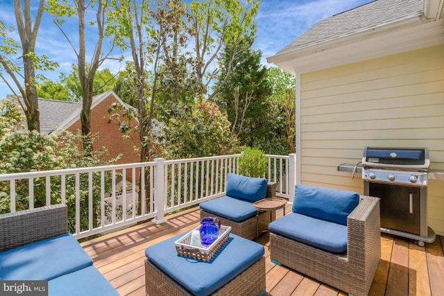 wooden terrace featuring outdoor lounge area and grilling area