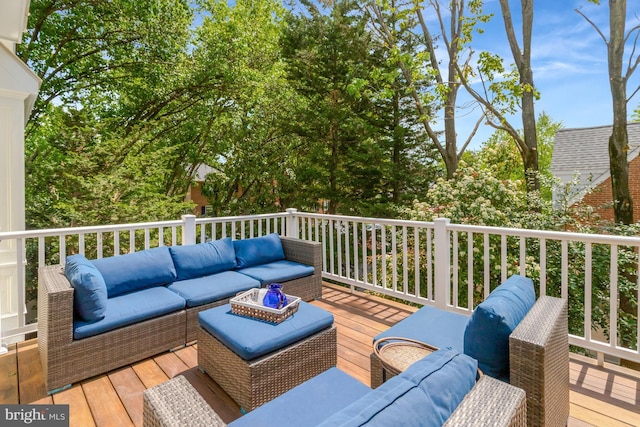 wooden terrace with outdoor lounge area