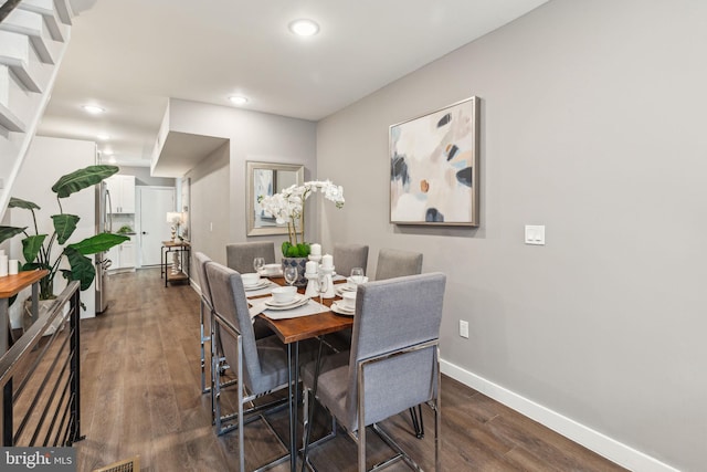 dining space with baseboards, recessed lighting, and dark wood-style flooring