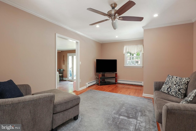 145 Palmer, Ewing, NJ 08618 - living room with crown molding, a ceiling fan, baseboard heating, and wood finished floors