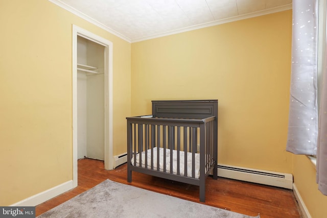 145 Palmer, Ewing, NJ 08618 - bedroom featuring baseboards, ornamental molding, a baseboard heating unit, and wood finished floors