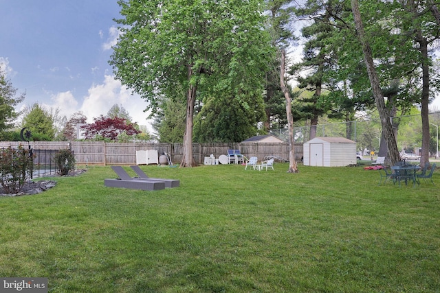 145 Palmer, Ewing, NJ 08618 - view of yard featuring a storage unit, fence, and an outbuilding