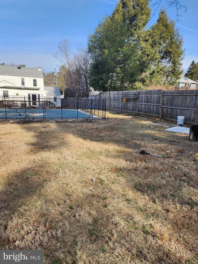 view of yard with a fenced in pool and a fenced backyard