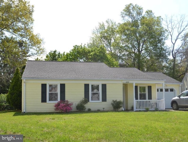 single story home featuring covered porch, a front yard, and an attached garage