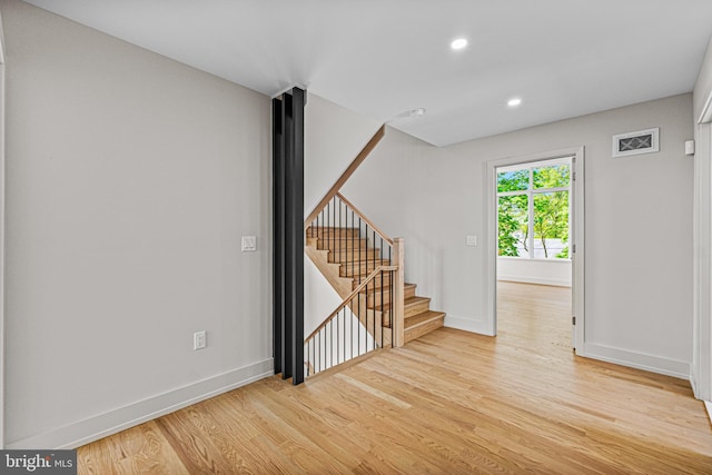 300 Ewing St, Princeton, NJ 08540 - empty room featuring light wood finished floors, baseboards, stairway, and recessed lighting