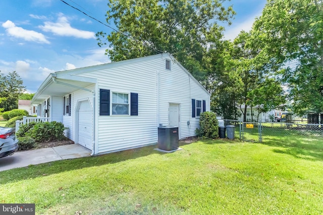 9 Central Ave, Pocomoke City, MD 21851 - view of property exterior with central AC, a garage, and concrete driveway