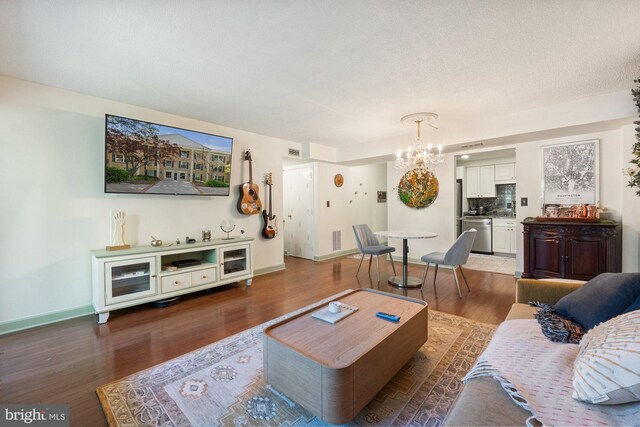 7651 Tremayne Pl Unit 207, Mclean, VA 22102 - living area featuring baseboards, a chandelier, and wood finished floors