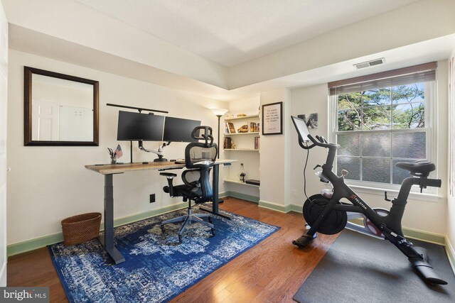 7651 Tremayne Pl Unit 207, Mclean, VA 22102 - workout area with baseboards, wood finished floors, and visible vents