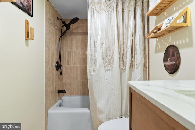 bathroom featuring toilet, shower / bath combination with curtain, and vanity