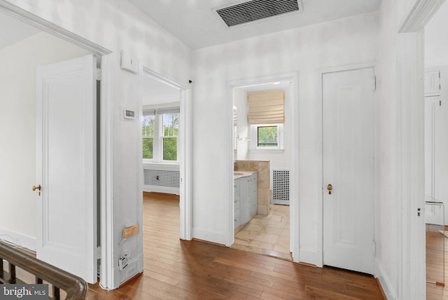 8300 Cedar Rd, Elkins Park, PA 19027 - hall featuring visible vents, hardwood / wood-style flooring, and baseboards