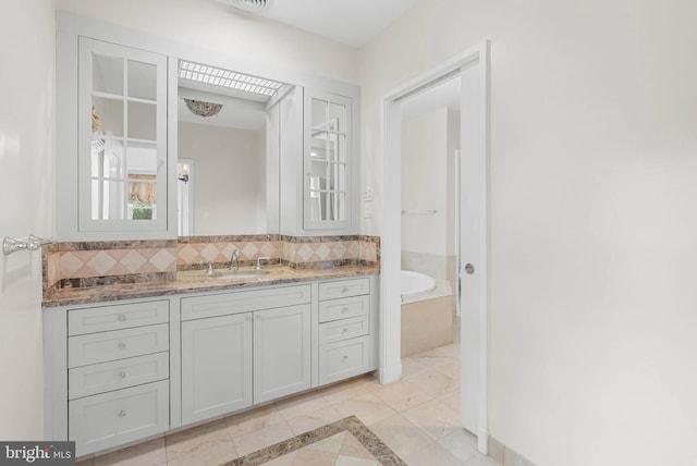 8300 Cedar Rd, Elkins Park, PA 19027 - full bath with tasteful backsplash, a garden tub, tile patterned flooring, and vanity