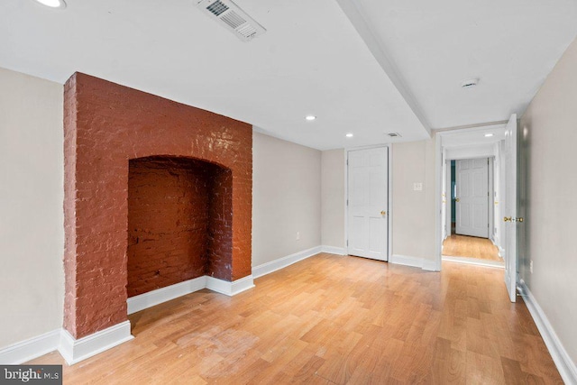 interior space featuring recessed lighting, visible vents, light wood-style flooring, and baseboards