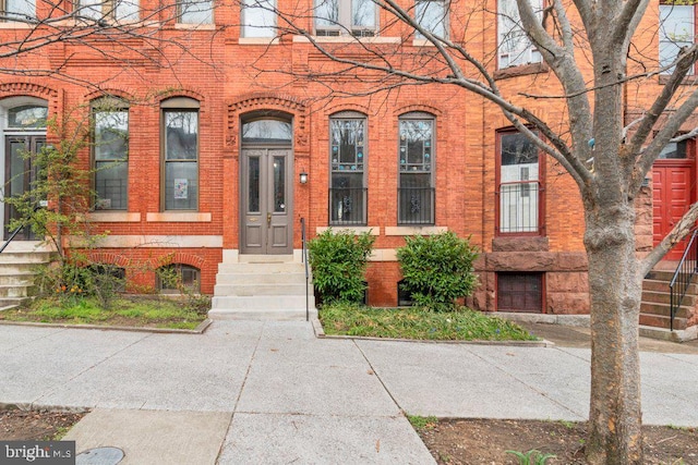 entrance to property with brick siding