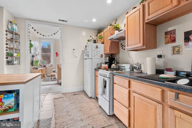 kitchen with recessed lighting, white appliances, light brown cabinets, under cabinet range hood, and visible vents