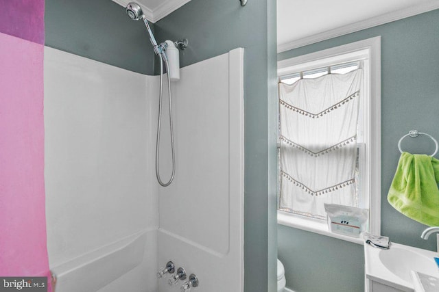 full bathroom with crown molding, toilet, baseboards, and  shower combination