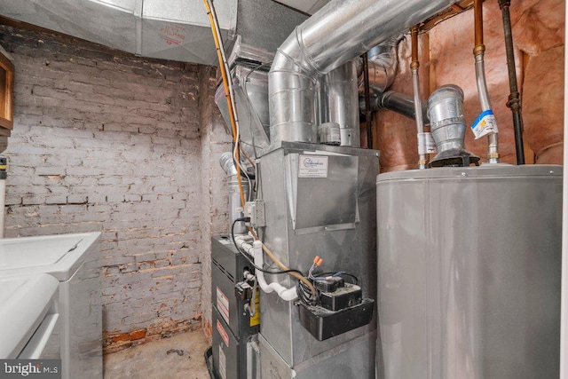 utility room featuring washer and dryer and gas water heater