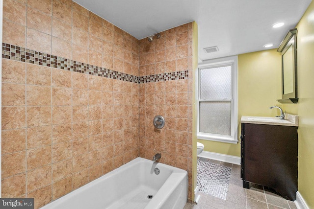 full bath with toilet, shower / bath combination, vanity, baseboards, and visible vents