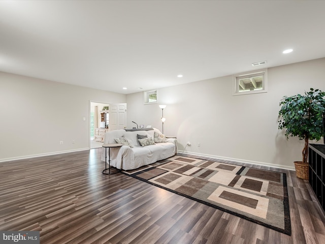 living area with wood finished floors, recessed lighting, and baseboards