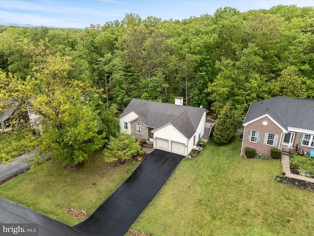 view from above of property with a forest