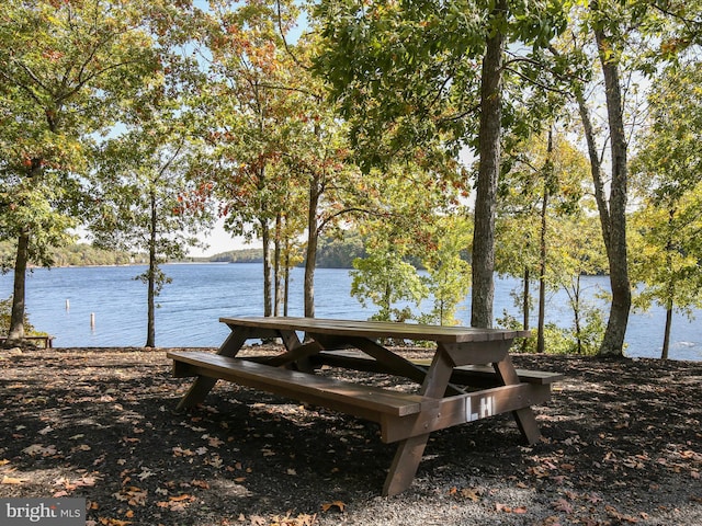 surrounding community with a water view