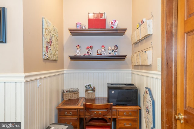 office space with a wainscoted wall