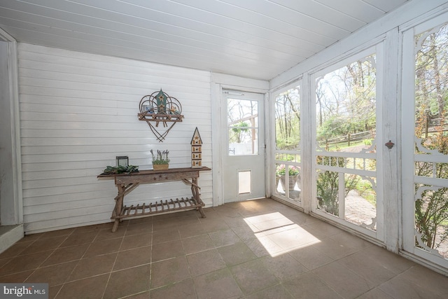 sunroom / solarium featuring tile patterned flooring