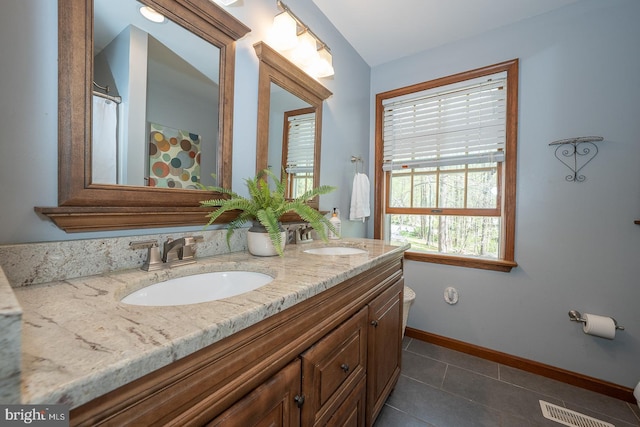full bathroom with visible vents, a sink, tile patterned floors, and double vanity