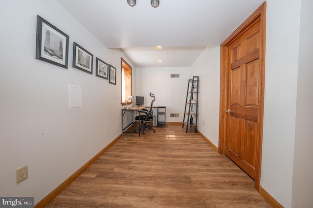 hallway featuring recessed lighting, baseboards, visible vents, and wood finished floors