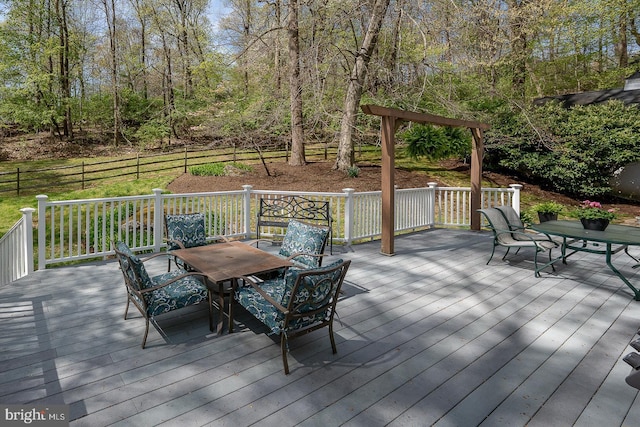 deck featuring outdoor dining area