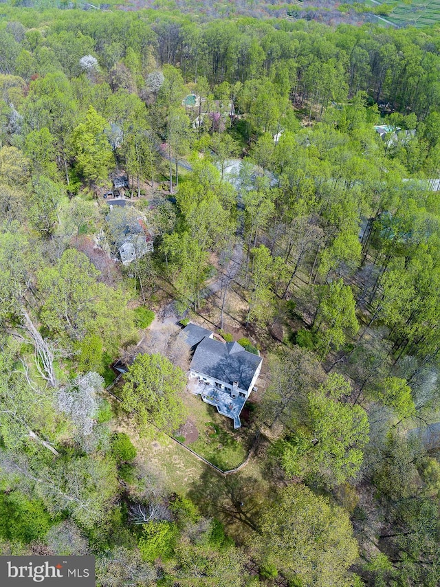 drone / aerial view with a view of trees