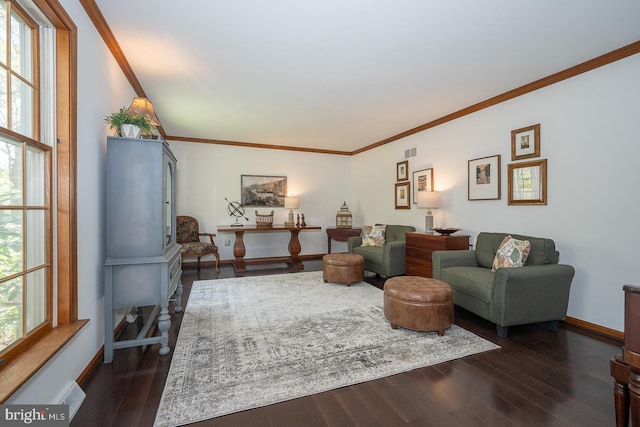 living room featuring crown molding, baseboards, and dark wood finished floors